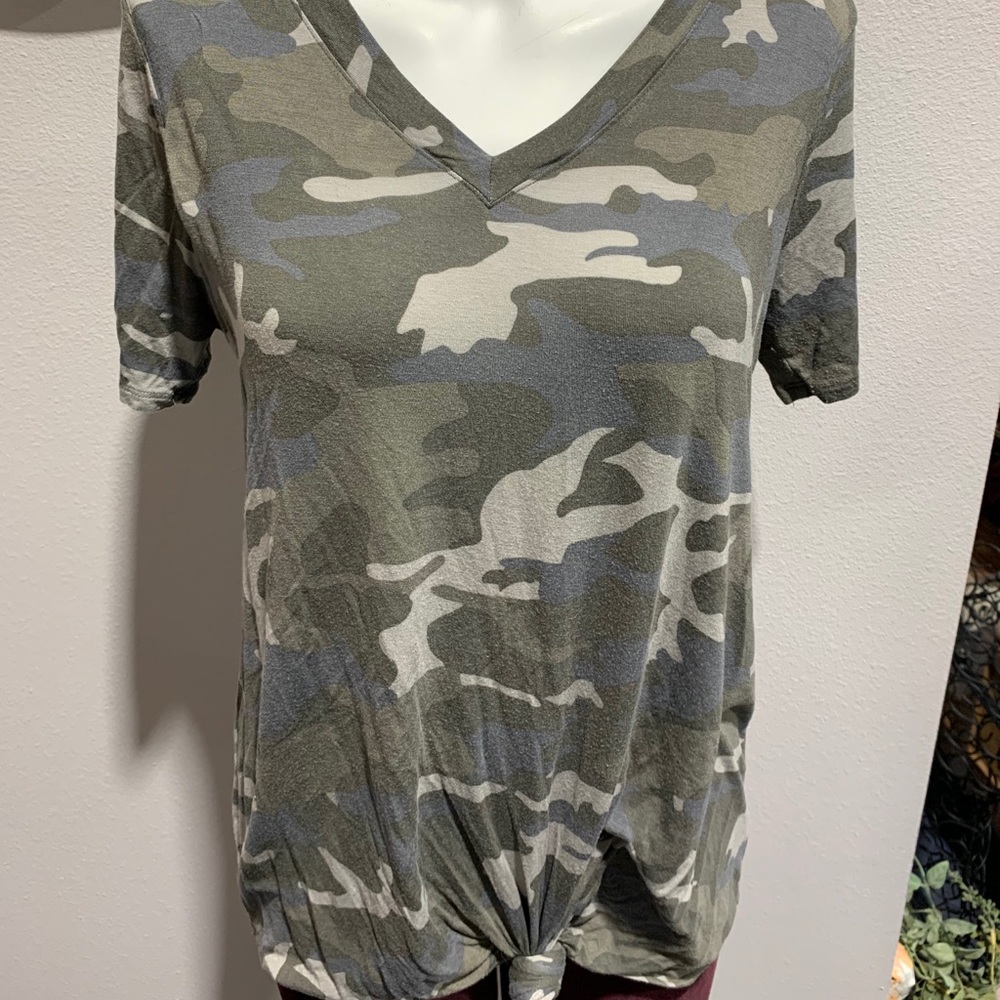 Camo top with a tied not at the bottom.